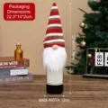 Christmas gnome wine bottle cover with red and white striped knitted hat and beard - Red