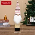 Christmas gnome wine bottle cover with pink striped knitted hat and white beard - Pink