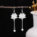 Retro ethnic style silver-colored long tassel earrings with lotus flower filigree design - Lotus Tassel Chain Earrings (E5580-2) / Silver