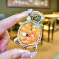 Close-up of a mini transparent acrylic turtle ornament filled with orange decorative beans - Luminous Bubble Bead Turtle (Without Buckle) / 1 Piece (Without Keychain) / Orange