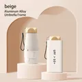 Mini portable capsule umbrella in beige color with aluminum alloy frame and UV protection - 6-Rib Black Glue UV Gold Handle / Pearl White