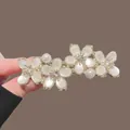 Golden elegant flower hair clip with white petals, pearls and sparkling rhinestones - Gold Cat Eye Stone Four-Flower Spring Clip