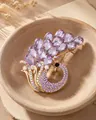 Close-up of elegant purple peacock brooch with luxurious purple crystal feathers. - 14K Gold Color Purple Peacock Style