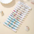 Close-up detail of handmade bohemian shell and starfish braided bracelet set on card - Starfish Shell Turquoise Style (SY1161-1) / 12 Pieces