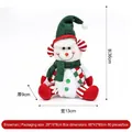 Festive Christmas snowman plush doll with green knit hat and scarf sitting holiday decoration - Red and Green Knitted Sitting Snowman Figurine