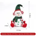 Festive Christmas snowman plush doll with green knit hat and scarf sitting holiday decoration - Red and Green Knitted Sitting Snowman Figurine
