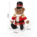Nutcracker soldier plush teddy bear with knitted red uniform and black hat - Sitting Soldier Teddy Bear Red