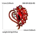 Close-up of red heart-shaped brooch with teardrop gem and iridescent rhinestones. - Antique Gold-Red (0026-RD)