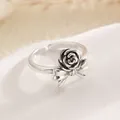 Vintage silver open ring featuring a rose and bow design on a white textured stone - Rose Bow (0414)
