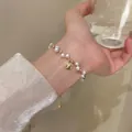 Elegant pearl bead bracelet with vintage gold coin pendant for women - Gold Embossed Coin Pendant Artificial Pearl Style