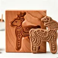 Handcrafted wooden cookie mold with an intricate reindeer pattern for baking cookies - Deer
