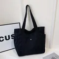 Large capacity black canvas tote bag with side pockets for stylish office commuting. - Upgraded Version with Lining / Black