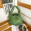 Detailed view of a green hand-woven cotton rope mesh bag perfect for beach vacation style - Green (with inner bag)