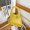 Detail showing a yellow hand-woven cotton rope net bag placed on a rustic wooden shelf - Yellow (With Inner Bag)