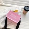 Bolso bandolera de gelatina rosa transparente a la moda con correa y etiqueta amarilla - Talla única / Rosa