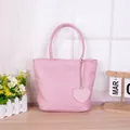 Sweet pink nylon tote bag for women featuring a heart pendant and double top handles - Handbag With Heart Pendant / Pink