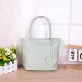 Light mint green nylon dopamine tote bag with heart shaped charm for ladies casual wear - Handbag With Heart Pendant / Green