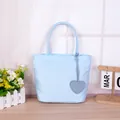 Stylish pastel blue casual tote bag featuring a cute heart charm ornament for women - Blue