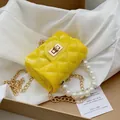 Mini yellow quilted jelly bag featuring elegant pearl handle and gold chain strap - Yellow