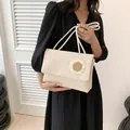 Chic beige woven straw shoulder bag for women with decorative sunflower ornament - Beige