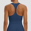 Back view of a solid dark blue racerback sports bra designed for yoga and gym fitness sessions. - S / Tops / Navy Blue