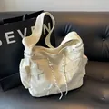 Stylish cream corduroy tote bag featuring fuzzy star patches and adjustable drawstring. - Corduroy Star Bag (088) / Off-White (Without Pendant)