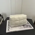 White quilted down cosmetic bag with cloud-like puffiness and square stitch detail - White