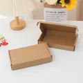 Detailed view of open and closed brown kraft paper corrugated mailing boxes for shipping - 20*13*3cm / Kraft Color