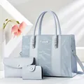 Set di 3 borse azzurre con trama a righe stropicciate e logo in metallo - Blu
