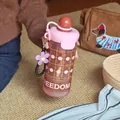 Stylish portable pink frosted water bottle featuring a cute flower charm and freedom print - 720ml / Frosted Style (GP-4150-A) / Matte Coffee