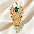Detailed macro view of a vintage peacock brooch with colorful rhinestones on silk fabric - Multicolor Rhinestone Peacock (567-1) / Green (567-1)