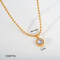 Close-up of gold stainless steel necklace detail with 12mm crystal pendant and 40+5cm chain - Roman Numerals Round Pendant (G31) / Gold