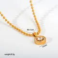 Close-up of gold stainless steel pendant necklace with 13mm size and 8.9g weight - Round Halo Pendant (G32) / Gold