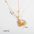 Macro view of a gold heart pendant with crystal inlay showing precise measurements - Open Heart Pendant (G37) / Gold