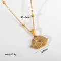 Detailed view of gold stainless steel necklace with rhinestone-studded lip pendant - Red Lips Pendant (G38) / Gold