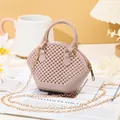 Stylish mauve mini shell jelly bag featuring a beaded texture and golden chain strap. - Apricot