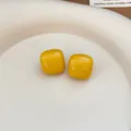 Minimalist bright yellow enamel square stud earrings featuring a smooth glossy finish - Yellow