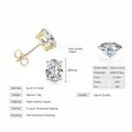 Classic gold stud earrings featuring a large 6x8mm oval-cut sparkling cubic zirconia stone - Oval Style / 6X8mm / Gold