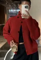 Close-up of a vibrant red chunky knit cardigan with high collar and black buttons. - S / Tops / Red