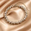 Gepolijste roestvrijstalen armband met dichte ronde schakels op champagne satijn - 16+5cm / Staalkleur