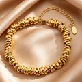 Bracelet en acier inoxydable doré avec perles spirales sur fond de tissu en satin champagne - 16+5cm / Or