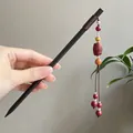 Elegant ebony wood hair stick with red beaded tassel for traditional Chinese hairstyles - Hollow Red Bead Step-Shake Style (7605)