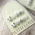 Macro detail of 3D puppy press-on nails with cute plaid and colorful dot patterns. - Large (L) / Short Round Nail Type (653)