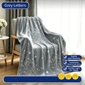 Grey glow-in-the-dark flannel blanket with Moon and Back text and star patterns. - 100*150cm / Grey Letter