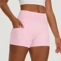 Women's light pink high-waisted yoga shorts with functional side pockets for fitness - Light Pink