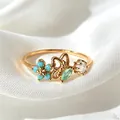 Zierlicher verstellbarer Goldring mit türkisfarbener Blume Schmetterling und Zirkon - Einstellbar Offen / Blauer Blumen-Schmetterlings-Stil (JZ099)