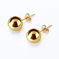 Detailed view of polished gold titanium steel round ball stud earrings with smooth finish - 2.0mm / Gold