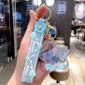 Creative light blue sakura keychain with preserved flower petals and flowing liquid glitter shaker - Blue