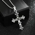 Macro detail of a retro silver gothic cross pendant on a textured jewelry box - Pendant Only (8461) / Antique Silver