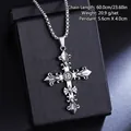 Detailed view of a vintage titanium steel cross pendant necklace on a black display box. - Carved Cross Necklace (08464) / Chain Length 60cm / Antique Silver